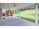 Covered patio with ceiling fans overlooking a spacious backyard with a wood fence at 117 Kiara Ln, Stockbridge, GA 30281