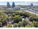 Aerial view of neighborhood with city skyline and highway in the background at 30 Dunwoody Springs Dr, Atlanta, GA 30328