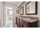 Bathroom features double sinks, granite countertops, framed mirrors, and tile floors at 30 Dunwoody Springs Dr, Atlanta, GA 30328