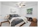 Light and airy bedroom with hardwood floors, stylish decor, and a large window at 30 Dunwoody Springs Dr, Atlanta, GA 30328