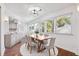 Bright dining area with hardwood floors, modern lighting, and large windows at 30 Dunwoody Springs Dr, Atlanta, GA 30328