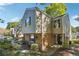 Charming townhome with a brick facade, complemented by mature trees and lush landscaping at 30 Dunwoody Springs Dr, Atlanta, GA 30328