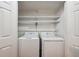 Closet featuring a stacked washer and dryer in a dedicated laundry area at 30 Dunwoody Springs Dr, Atlanta, GA 30328