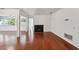 Bright living room featuring hardwood floors, a fireplace, and neutral walls at 30 Dunwoody Springs Dr, Atlanta, GA 30328