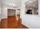 Living room showcasing hardwood floors, a kitchen view, and an open layout at 30 Dunwoody Springs Dr, Atlanta, GA 30328