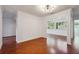 Bright living room with hardwood floors, white walls and contemporary light fixture at 30 Dunwoody Springs Dr, Atlanta, GA 30328