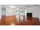 Spacious living room with hardwood floors and a cozy fireplace, perfect for relaxing and entertaining at 30 Dunwoody Springs Dr, Atlanta, GA 30328