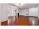 Open-concept living room with hardwood floors, neutral walls, and a fireplace at 30 Dunwoody Springs Dr, Atlanta, GA 30328