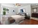 Bedroom with a large window with ample natural light, ceiling fan, and ensuite bathroom at 30 Dunwoody Springs Dr, Atlanta, GA 30328