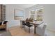 Bright dining area featuring a stylish table, modern chairs, and large windows offering natural light and hillside views at 3200 Bateman Dr, Atlanta, GA 30354