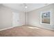 Cozy bedroom with a neutral color scheme, carpet flooring, and natural lighting at 431 Crestmont Ln, Canton, GA 30114