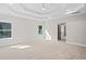 Large main bedroom featuring a tray ceiling, carpet floors, and natural light at 431 Crestmont Ln, Canton, GA 30114