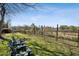 Relaxing backyard featuring seating and lush greenery with a view of the city skyline in the distance at 604 Ansley Villa Ne Dr, Atlanta, GA 30324