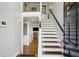 Inviting foyer features hardwood floors and a staircase with modern railings at 604 Ansley Villa Ne Dr, Atlanta, GA 30324