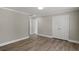 Spacious bedroom offers a sizable closet, hardwood floors, neutral paint, and a window for natural light at 1088 Hubbard Sw St, Atlanta, GA 30310