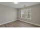 Bedroom featuring hardwood floors, neutral paint, and a window for natural light at 1088 Hubbard Sw St, Atlanta, GA 30310
