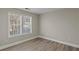 This cozy bedroom features hardwood floors, neutral paint, and a window for natural light at 1088 Hubbard Sw St, Atlanta, GA 30310
