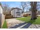 Exterior view of the house with a driveway and lush green lawn at 1088 Hubbard Sw St, Atlanta, GA 30310