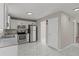 Well-lit kitchen with stainless steel appliances, white cabinets, and a marble tiled floor at 1088 Hubbard Sw St, Atlanta, GA 30310