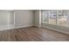 Well-lit living room featuring hardwood floors and bright, sunny windows at 1088 Hubbard Sw St, Atlanta, GA 30310