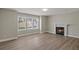 Open living area with wood flooring and a cozy fireplace at 1088 Hubbard Sw St, Atlanta, GA 30310