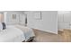 Bright bedroom features neutral walls, soft carpet, and ample space, ideal for relaxation and rest at 1590 Sungrown Way, Mcdonough, GA 30253