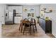 Bright dining area featuring modern furniture and natural light from the window at 1590 Sungrown Way, Mcdonough, GA 30253