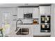 Bright, modern kitchen with stainless appliances, granite counters and white cabinets with plenty of storage space at 1590 Sungrown Way, Mcdonough, GA 30253