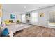 Bright living room featuring modern decor, sleek fireplace, and a comfortable sectional sofa at 1590 Sungrown Way, Mcdonough, GA 30253