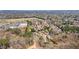 Panoramic aerial view of a community surrounded by nature and trees at 6715 Brookline Ct, Cumming, GA 30040