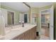 Bathroom features a large double sink vanity, ample counter space, and a walk in shower in the adjoining room at 6715 Brookline Ct, Cumming, GA 30040