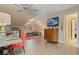 Bonus room provides a multi-use living space, hardwood floors, and natural light with an en suite door to another room at 6715 Brookline Ct, Cumming, GA 30040