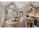 Breakfast area with large windows, chandelier and table, adjacent to open kitchen at 6715 Brookline Ct, Cumming, GA 30040