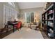 Cozy home office with natural light, built-in bookshelves, and hardwood flooring at 6715 Brookline Ct, Cumming, GA 30040