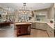 Spacious, modern kitchen with a large island, stainless steel appliances, and an open floor plan at 6715 Brookline Ct, Cumming, GA 30040