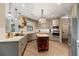 Well-equipped kitchen with stainless appliances, custom cabinets, and a butcher block island at 6715 Brookline Ct, Cumming, GA 30040