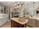 Open-concept kitchen with stainless steel appliances and seamless connection to a comfortable living space at 6715 Brookline Ct, Cumming, GA 30040