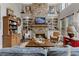 Inviting living room with stone fireplace, built-in bookshelves, and comfortable seating at 6715 Brookline Ct, Cumming, GA 30040