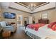 Bright main bedroom features stylish decor and a comfortable sitting area at 6715 Brookline Ct, Cumming, GA 30040