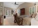 Main bedroom with sitting area, vaulted ceiling, plantation shutters, and doors that lead to the backyard at 6715 Brookline Ct, Cumming, GA 30040