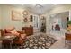Sitting room features a plush leather chair, floral rug, shuttered windows and an open doorway to the adjacent room at 6715 Brookline Ct, Cumming, GA 30040