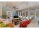 Bright sunroom with a vaulted ceiling, tile floor, and view of the pool at 6715 Brookline Ct, Cumming, GA 30040
