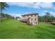 Spacious backyard with a wooden deck and a view of the surrounding landscape at 6117 Summerstone Ln, Douglasville, GA 30135