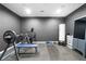 Finished basement with a home gym and equipment at 6117 Summerstone Ln, Douglasville, GA 30135