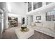 Spacious living room with high ceilings, fireplace, and open floor plan at 6117 Summerstone Ln, Douglasville, GA 30135