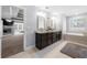 Main bathroom featuring double vanities, soaker tub, and modern fixtures at 6117 Summerstone Ln, Douglasville, GA 30135