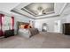 Spacious main bedroom with coffered ceiling, sitting area and en-suite bathroom at 6117 Summerstone Ln, Douglasville, GA 30135