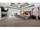 Spacious main bedroom with coffered ceiling, sitting area, and fireplace at 6117 Summerstone Ln, Douglasville, GA 30135