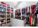 Walk-in closet with custom shelving and ample storage space for clothes and accessories at 6117 Summerstone Ln, Douglasville, GA 30135