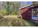 View of a spacious backyard with a latticed porch and a storage shed at 6582 Malvin Dr, Mableton, GA 30168